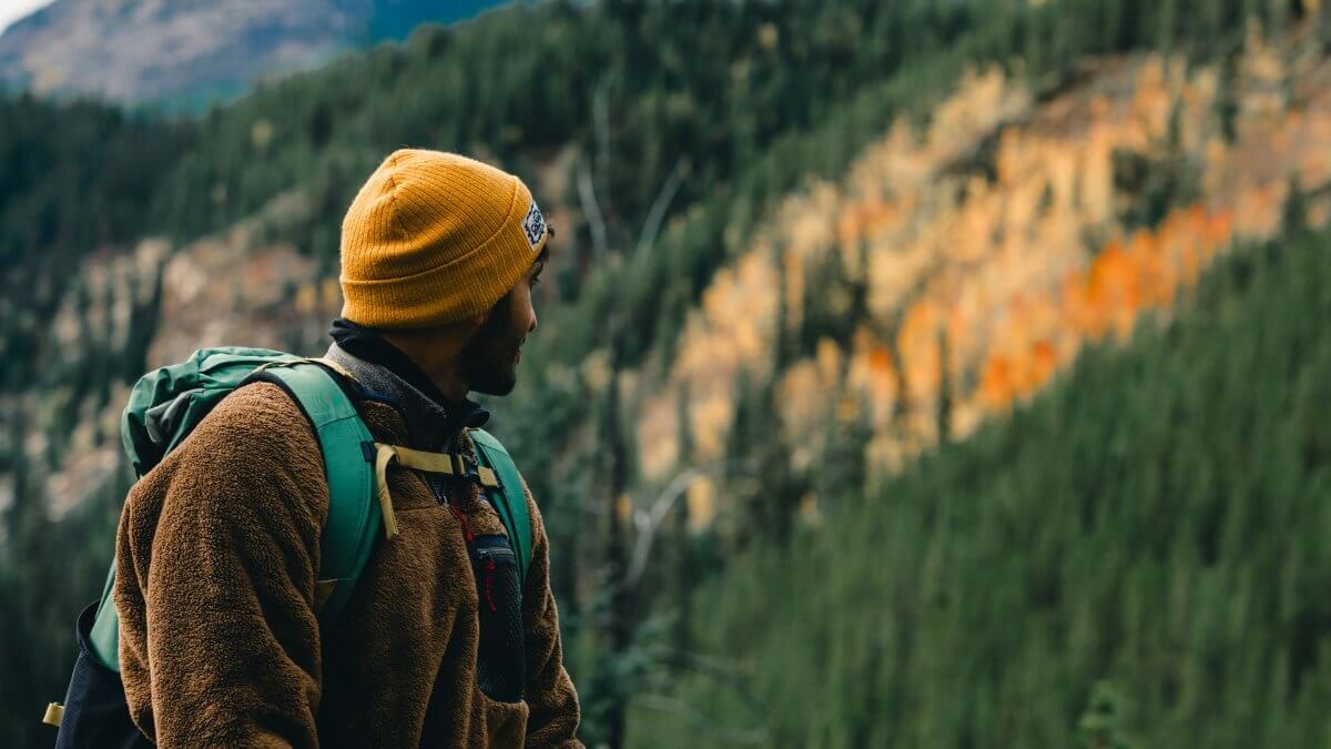 Facing Fears Through Exposure Therapy Person facing an open landscape, representing gradual exposure to feared situations